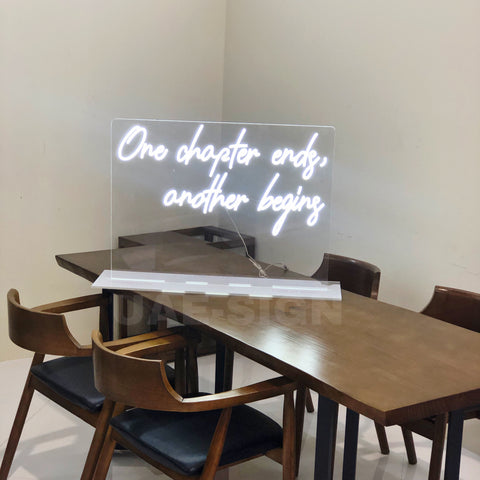 ONE CHAPTER ENDS ANOTHER BEGINS.NEON SIGN STAND
