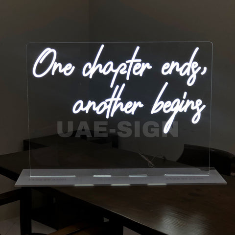 ONE CHAPTER ENDS ANOTHER BEGINS.NEON SIGN STAND